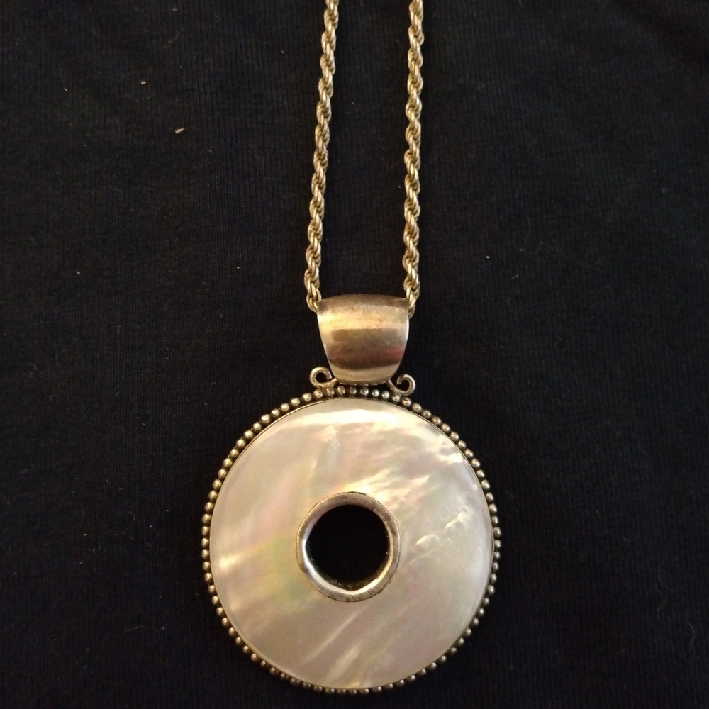 Mother of Pearl Pendant trimmed in Sterling Silver Marked 925